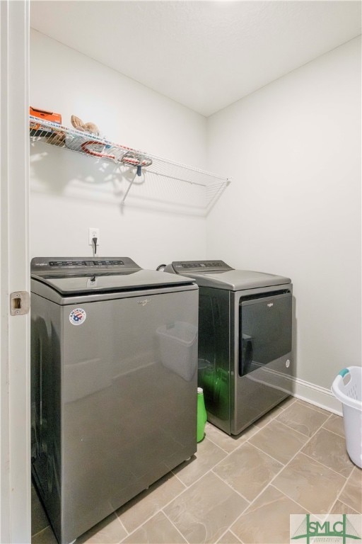 laundry room with washer and dryer