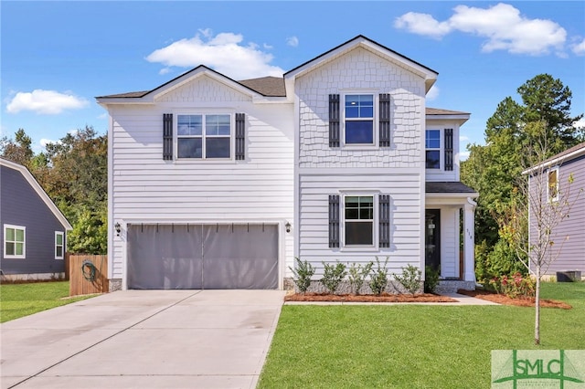 view of property with a garage and a front lawn