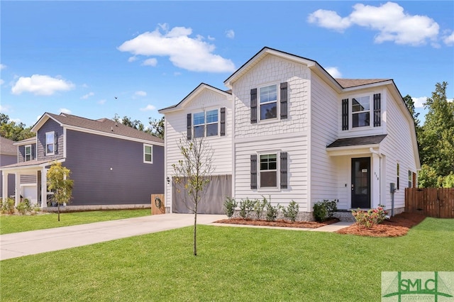 view of front of home with a garage and a front lawn