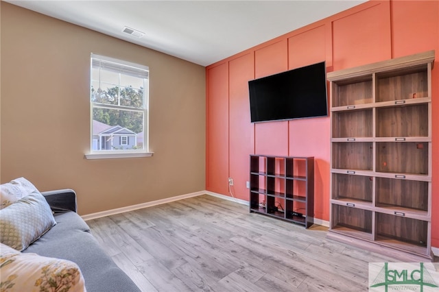 unfurnished living room with light hardwood / wood-style floors