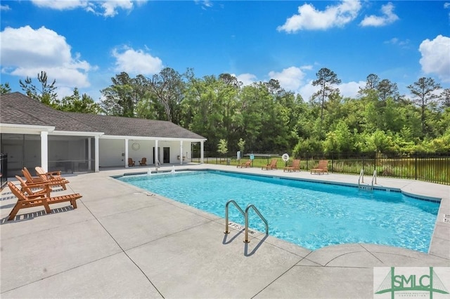 view of swimming pool featuring a patio