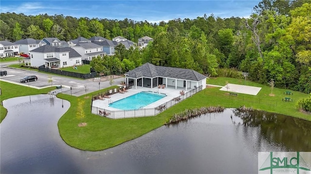 birds eye view of property with a water view