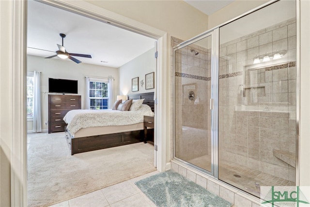 bathroom featuring ceiling fan, walk in shower, and tile patterned floors