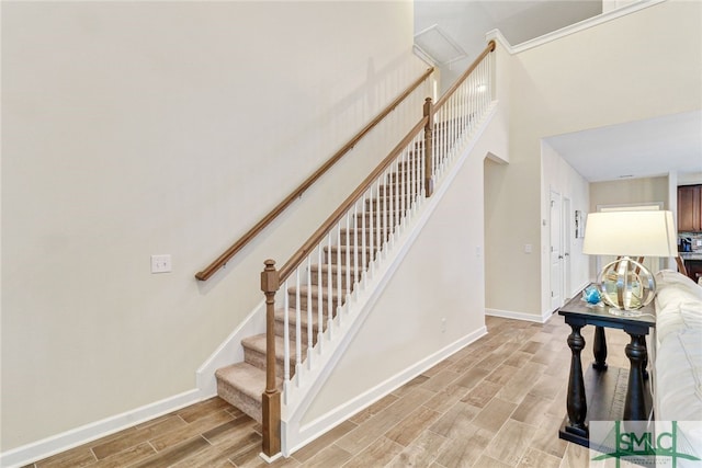 staircase featuring wood-type flooring