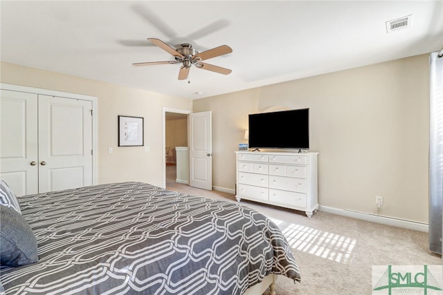 carpeted bedroom with a closet and ceiling fan