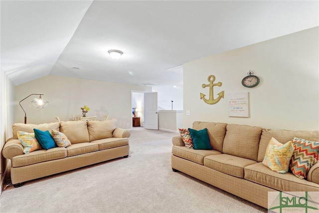 living room with lofted ceiling and carpet