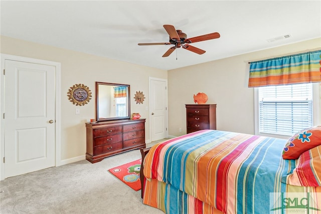 bedroom featuring ceiling fan and light colored carpet