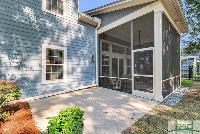 exterior space featuring a sunroom