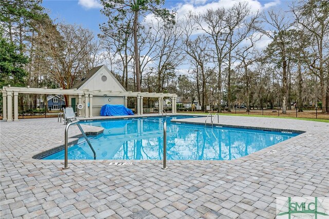 view of swimming pool featuring a pergola and a patio area