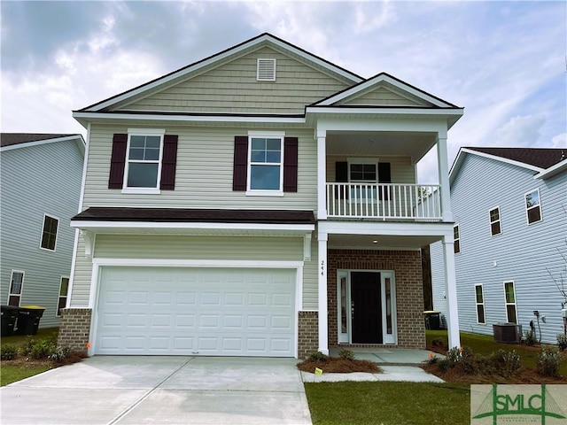 244 Brookline Dr, Savannah, GA 31407 - view of front of house with a balcony, brick siding, a garage, and concrete driveway