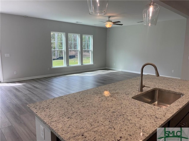 244 Brookline Dr, Savannah, GA 31407 - kitchen featuring ceiling fan, dark wood-type flooring, a sink, open floor plan, and pendant lighting