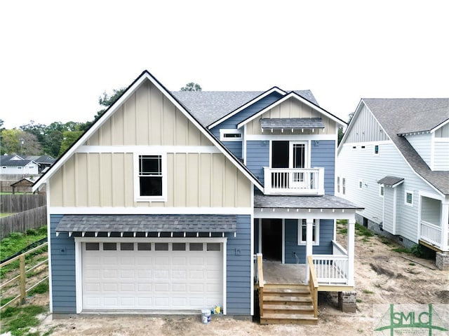 view of front of house featuring a garage and a porch