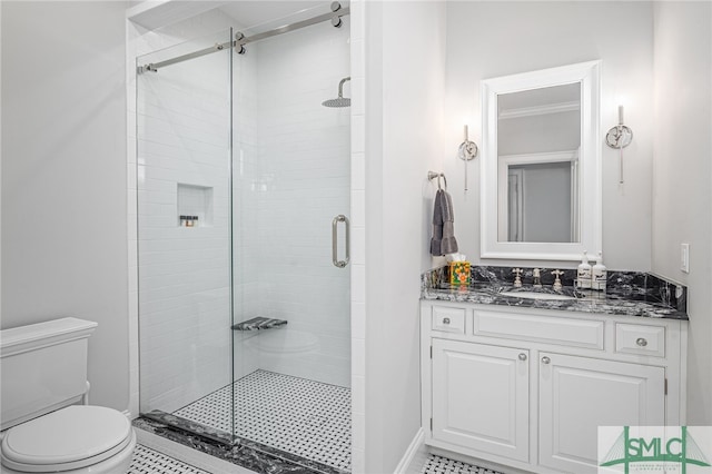 bathroom with walk in shower, tile patterned flooring, vanity, and toilet