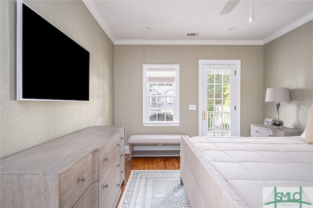 bedroom with ornamental molding, wood-type flooring, ceiling fan, and access to exterior