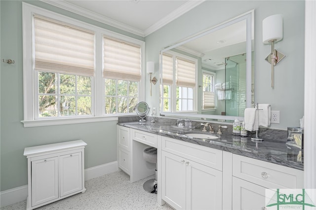 bathroom with a wealth of natural light, vanity, and crown molding