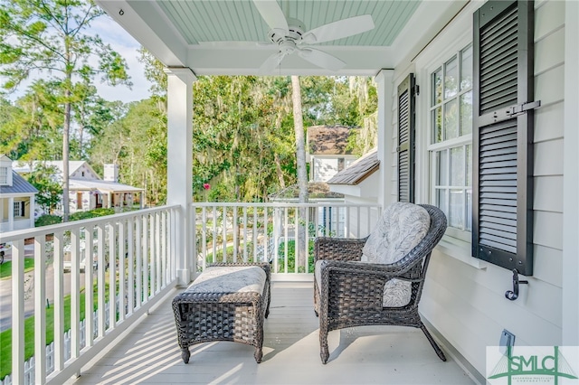 balcony with ceiling fan and covered porch