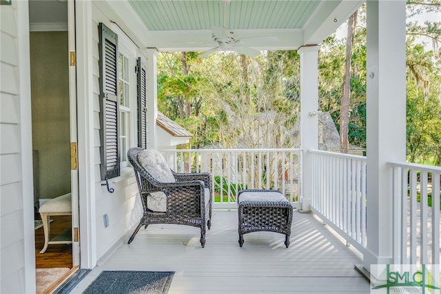 wooden deck with ceiling fan