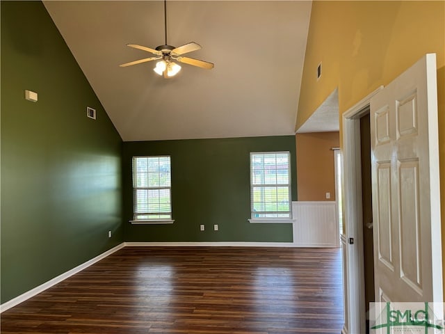 unfurnished room featuring high vaulted ceiling, plenty of natural light, and wood-type flooring