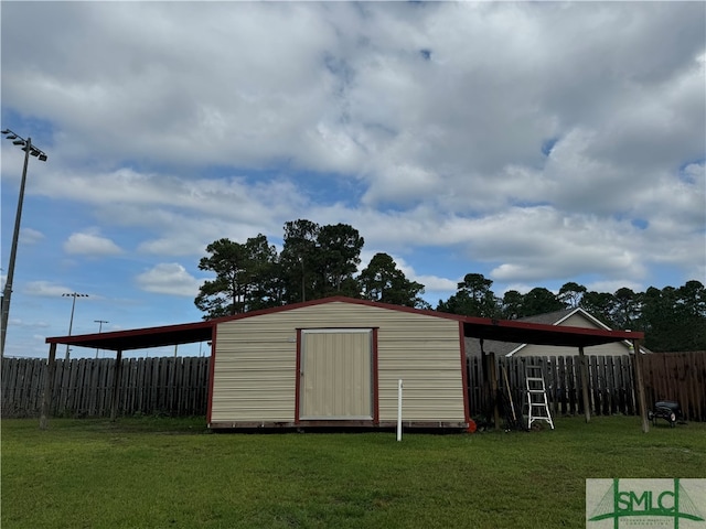 view of outdoor structure with a lawn