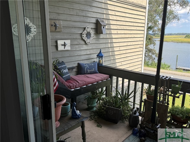 balcony featuring a water view