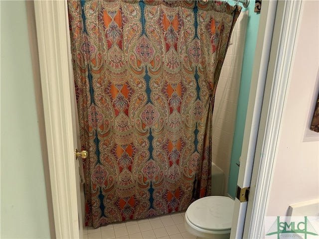 bathroom featuring tile patterned floors, shower / bath combo, and toilet