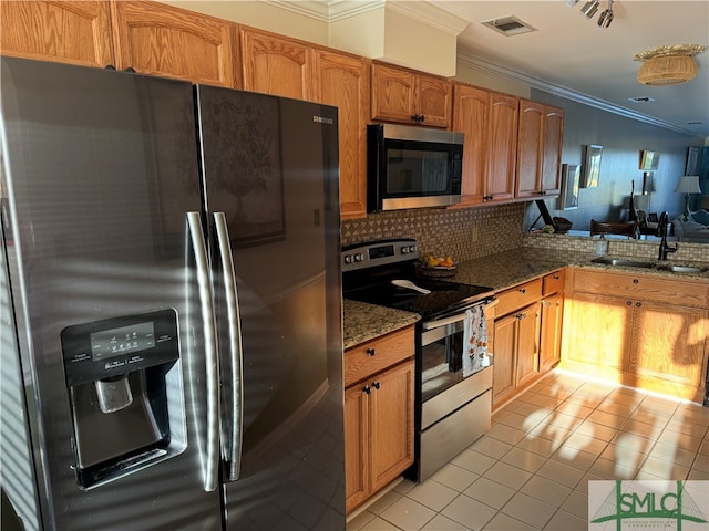 kitchen featuring appliances with stainless steel finishes, backsplash, crown molding, sink, and light tile patterned flooring