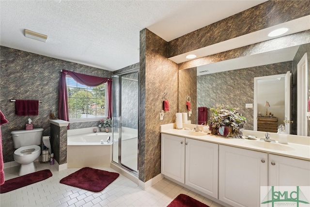 full bathroom featuring shower with separate bathtub, vanity, tile patterned flooring, toilet, and a textured ceiling