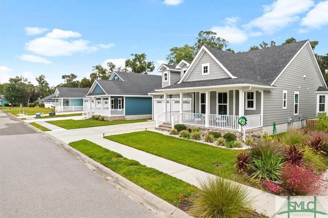 view of front of house with a garage and a front lawn