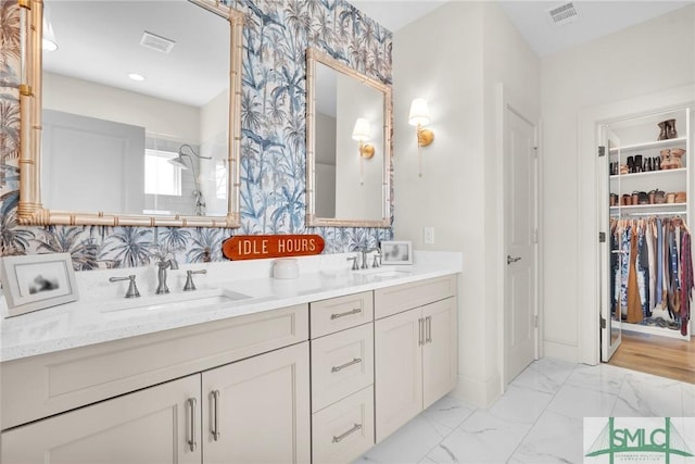 bathroom featuring decorative backsplash, vanity, and walk in shower