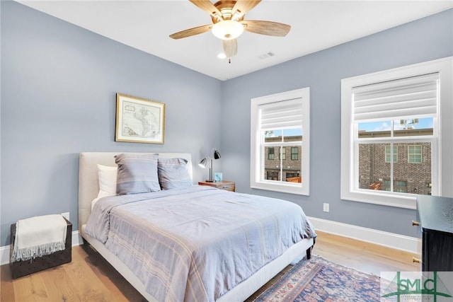 bedroom featuring ceiling fan and wood-type flooring