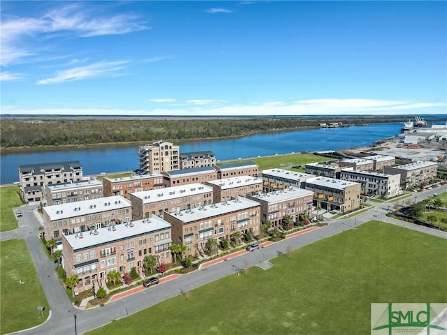 birds eye view of property with a water view