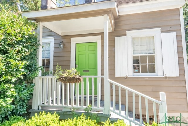 entrance to property with covered porch