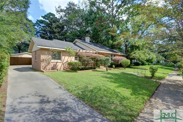 view of front facade featuring a front yard and a garage