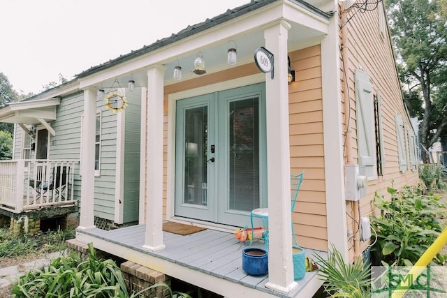 view of side of property featuring french doors