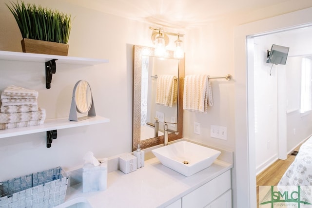 bathroom featuring vanity and hardwood / wood-style floors