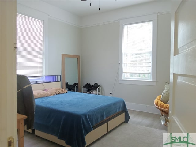 bedroom with hardwood / wood-style flooring