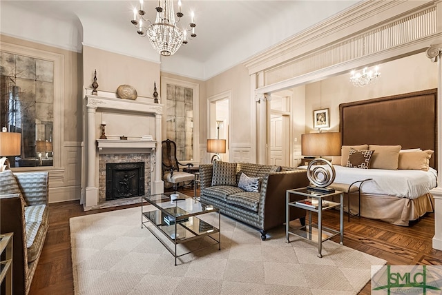 bedroom with an inviting chandelier, parquet flooring, and crown molding