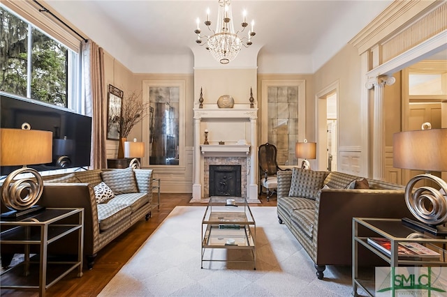 sitting room with hardwood / wood-style flooring and a notable chandelier