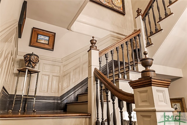 staircase with a high ceiling