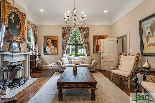 sitting room with dark hardwood / wood-style floors and a chandelier