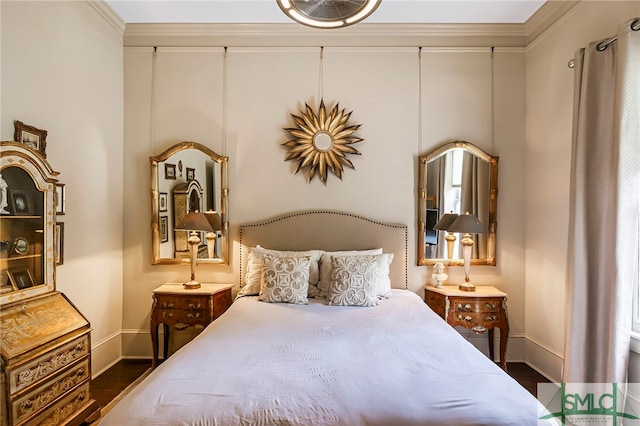 bedroom with crown molding and dark wood-type flooring