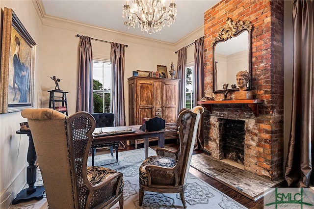 living area featuring a fireplace, crown molding, hardwood / wood-style floors, and a chandelier