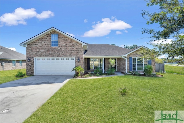 view of front of house featuring a front yard and a garage