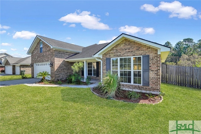 view of front of home with a garage and a front lawn