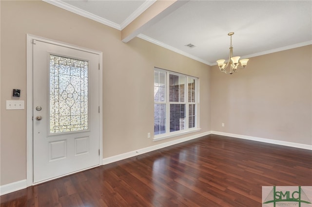 foyer with a notable chandelier, dark hardwood / wood-style floors, beam ceiling, and crown molding