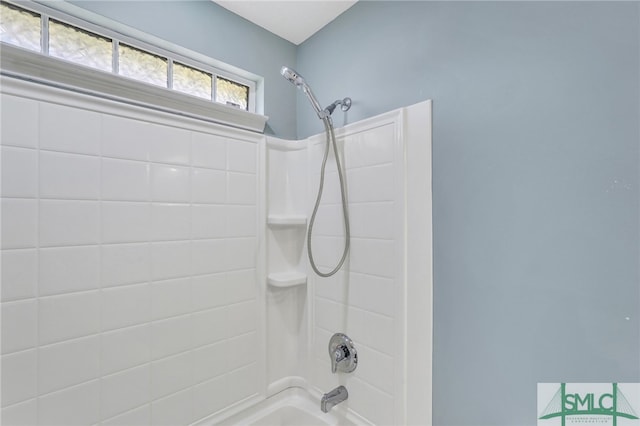 bathroom with bathing tub / shower combination