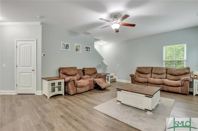 living room featuring light hardwood / wood-style floors and ceiling fan