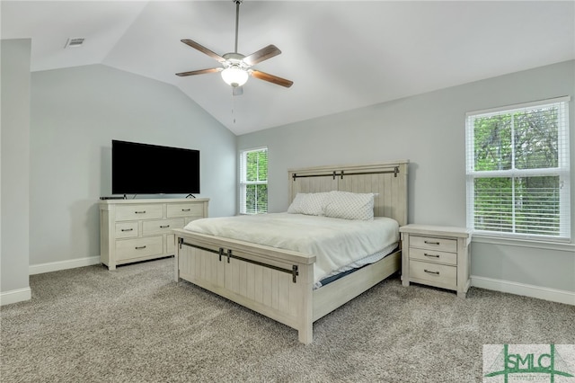 carpeted bedroom featuring vaulted ceiling and ceiling fan