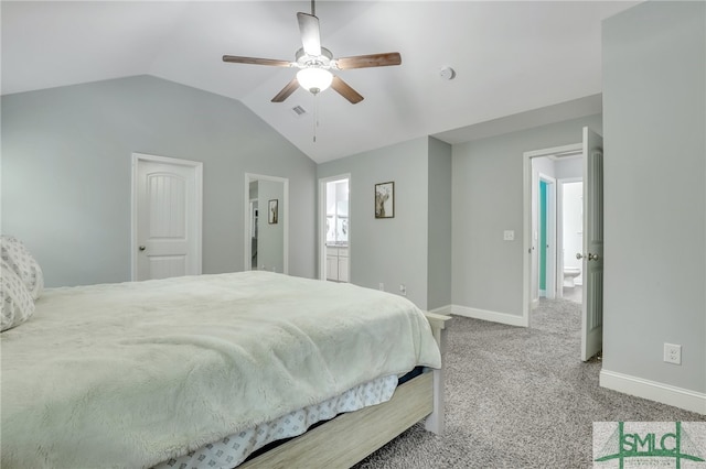 carpeted bedroom featuring ceiling fan, ensuite bathroom, and vaulted ceiling