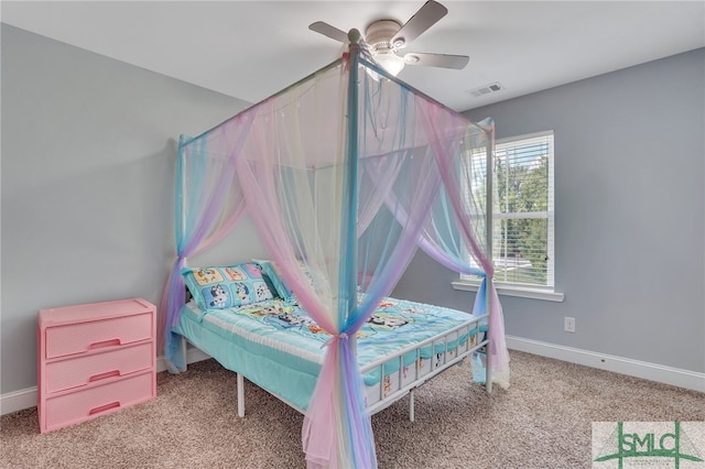 bedroom with carpet, ceiling fan, and multiple windows